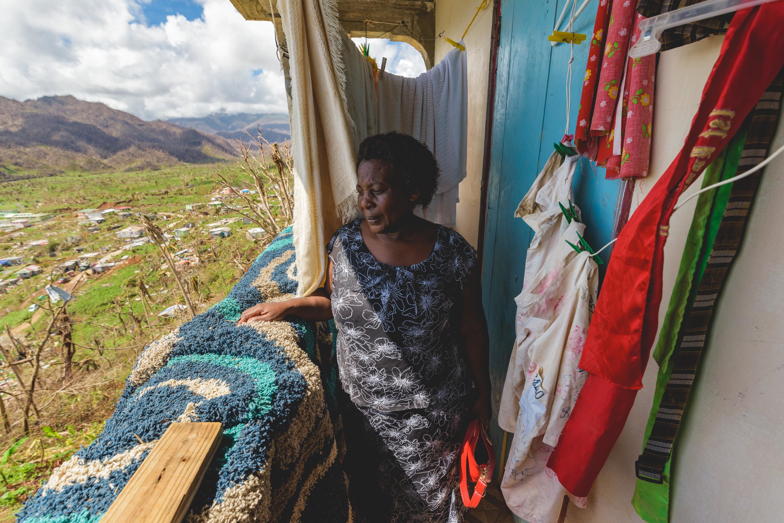 Castle Bruce, Dominica - Angelica Gasper hid from Hurricane Maria in a small, 3X5 ft patio of her house. There, she prayed, "God help me!" for 4 hours while her home shook on it's stilts.