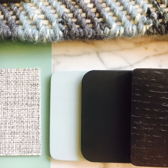 Love the juxtaposition of the dark, moody woods against the clean, minty shades of green and natural woven fabrics. 
