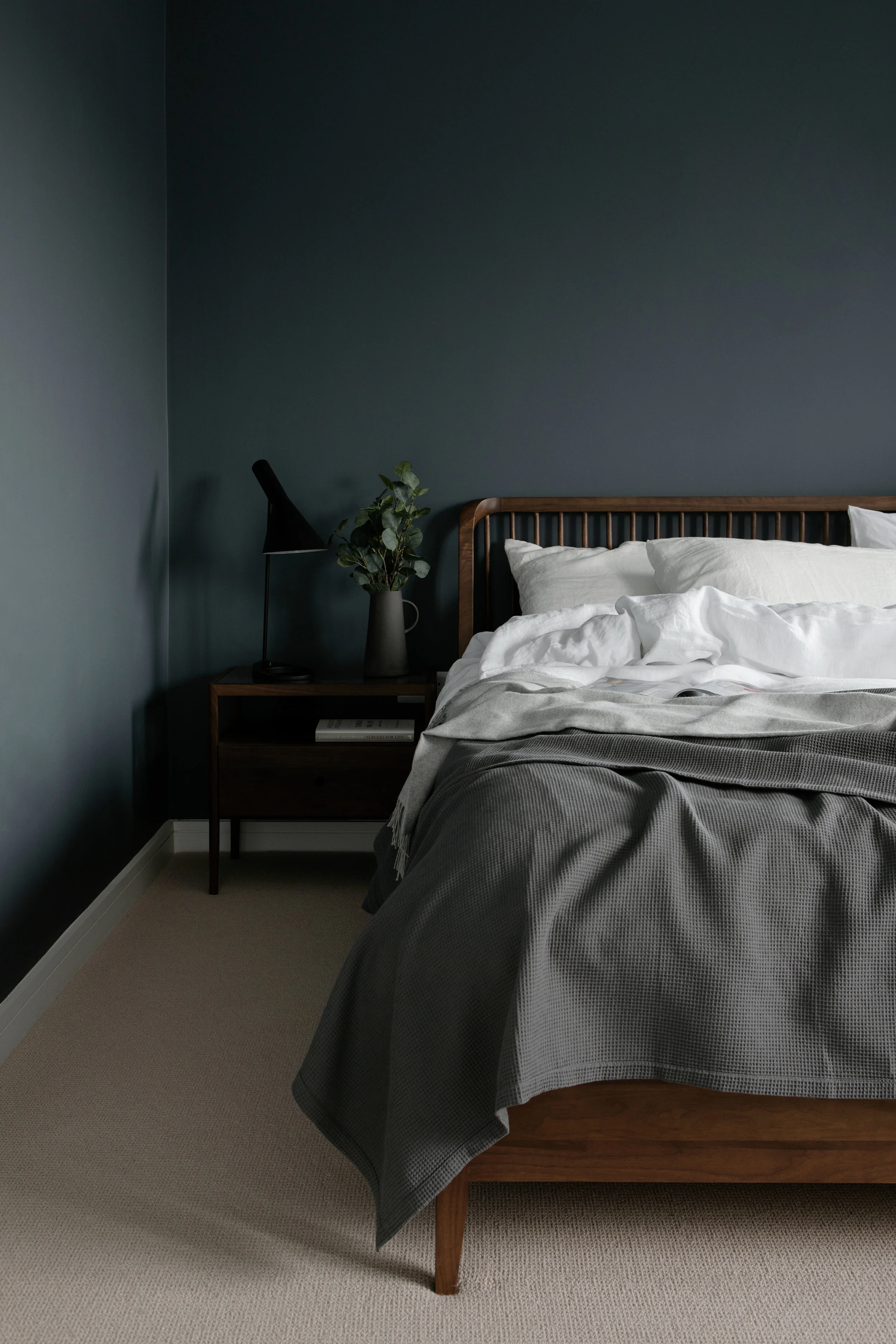 Our Ethnicraft Spindle bed completes this sophisticated moody bedroom. Photo credit: Ruth Maria Photography