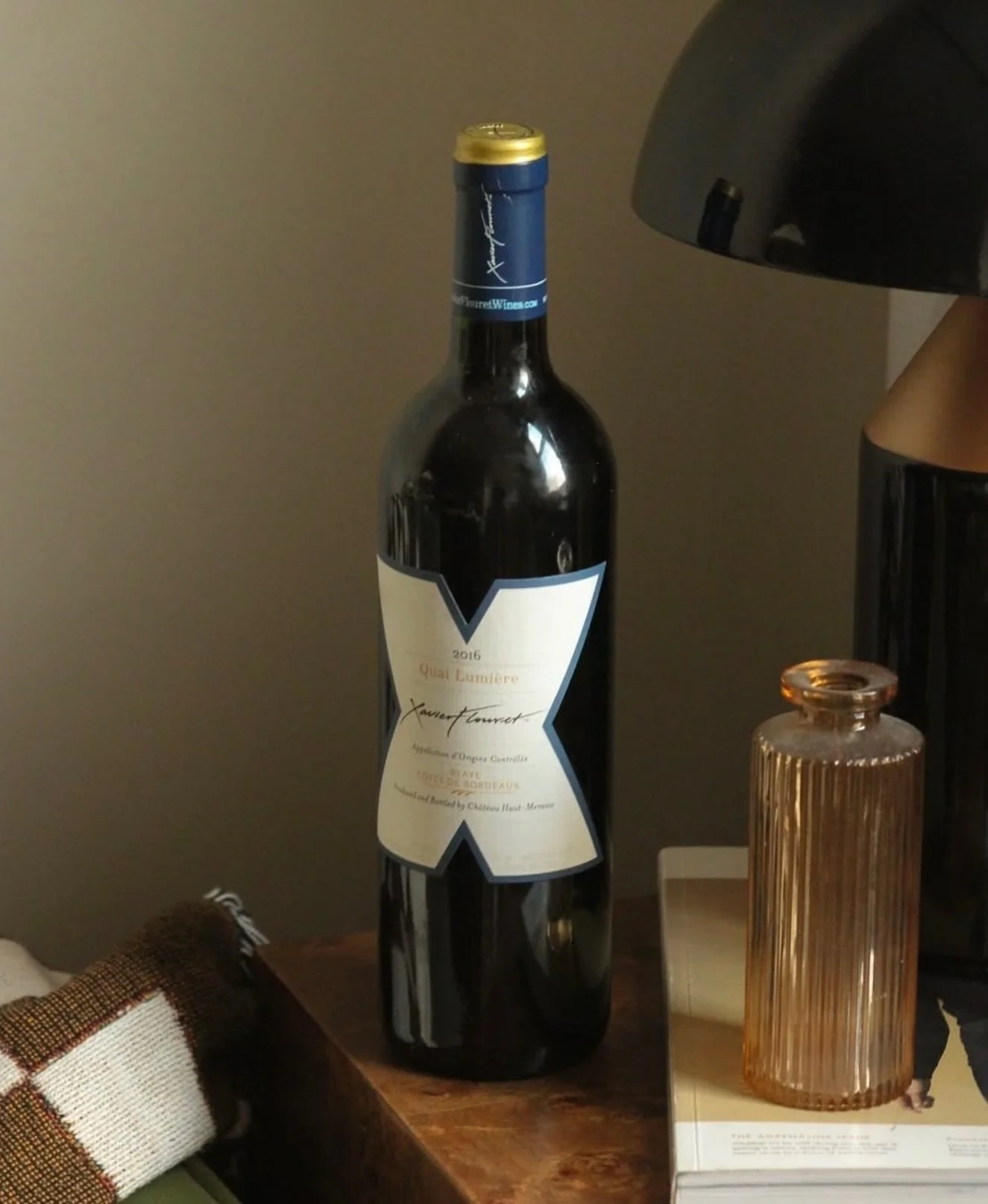 Settle into fall with Quai Lumi&egrave;re 🍷 Complex red fruit aromas and notes of coffee, chocolate, and vanilla are balanced with structured, fine tannins to create an inviting red for a crisp autumn evening.