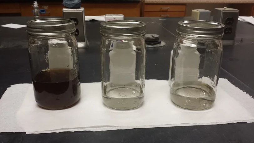 Landfill waste, also called leachate, (L) and cleaned water with contamination below EPA limits (center and right).