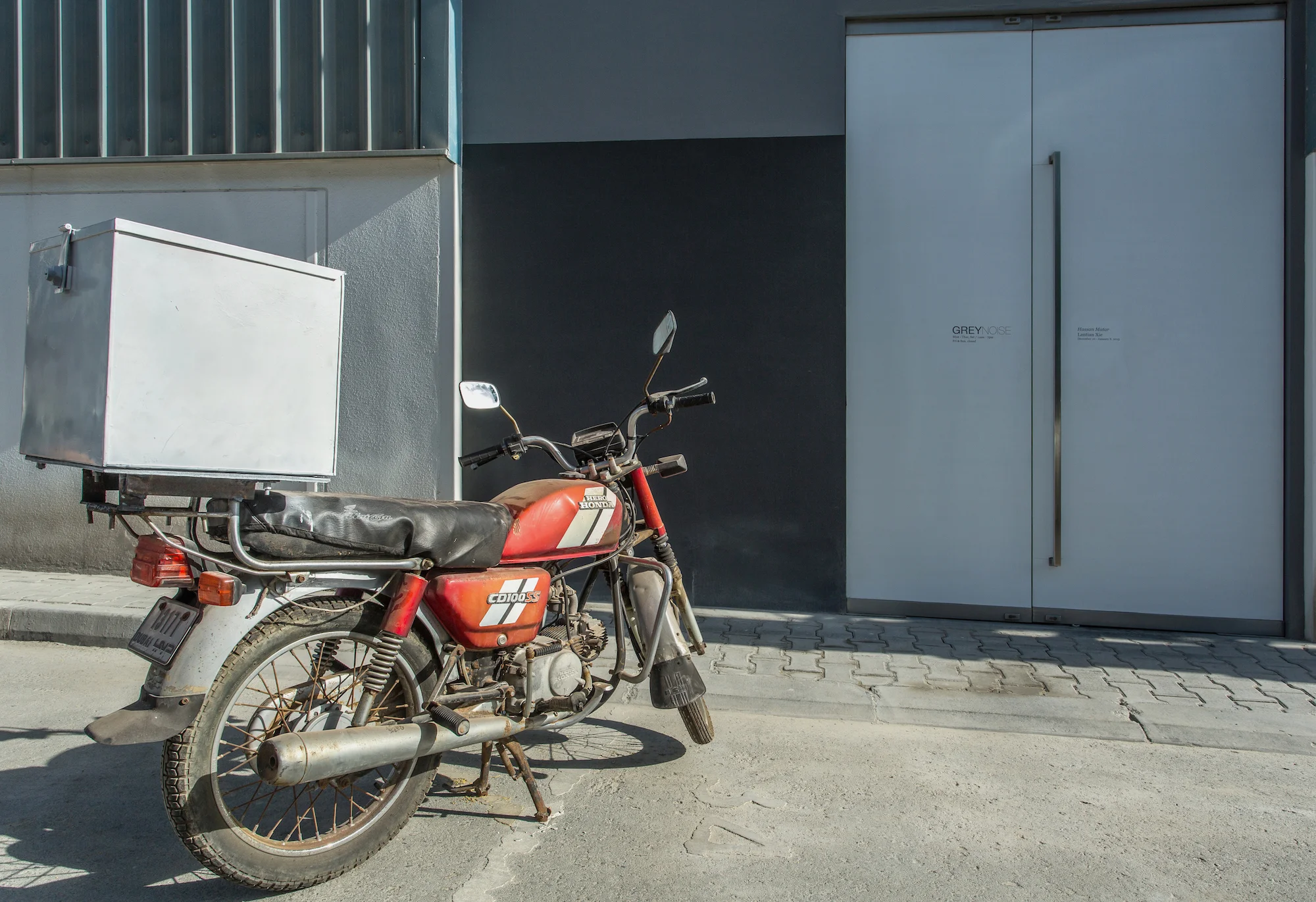 Home-delivery motorcycle parked outside 2014 Variable dimensions