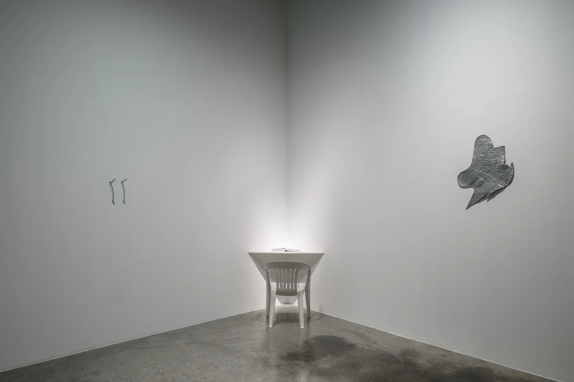 Installation view // L - R Left: Stéphanie Saadé, Logic Remains, 2014 - 2017, found electrical cables, new cables, dimensions variable Center: Paul Hage Boutros, Prosthetic Love, 2016, book publication (book one), 25.4 x 17.7 cm Right: Rodrigo Hernández, Finally free, 2017, papier-maché, wood, metal lacquer, 71 x 50 x 2.5 cm