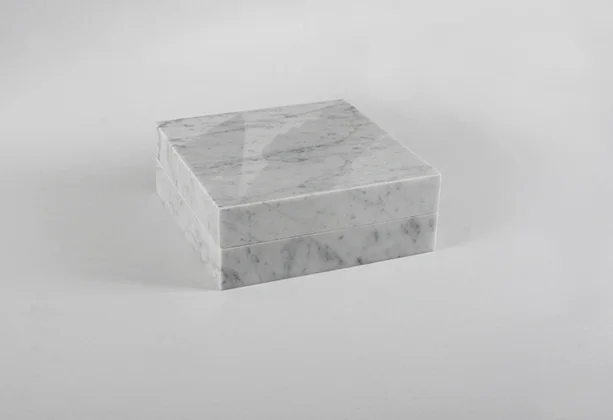 Night enclosed in marble (front) 2013 (ongoing series) Carrara marble, 1 cm3 of a night (Naas Forest, Mount Lebanon), metallic hinges 23 x 23 x 9 cm