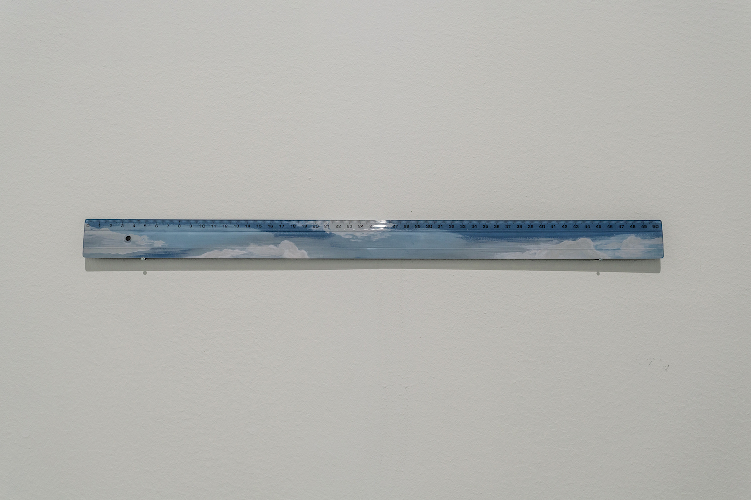  Stéphanie Saadé  The Day in Order 2015 Plastic ruler, acrylic paint 3.4 x 51 cm Unique variation 2/3  A day sky is painted at the back of a plastic ruler. The rational tool is subjected to the whim of a reverie. 