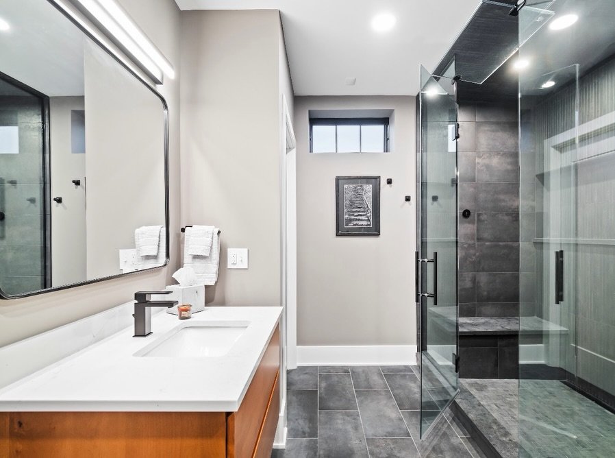 Check out the steam shower in the basement of our Edgewater renovation + addition project 🖤😍 

We love this bold design. Would you want this in your home? 

Thinking of renovating or building an addition? Visit mancusohomes.com 

#remodel #homeaddi