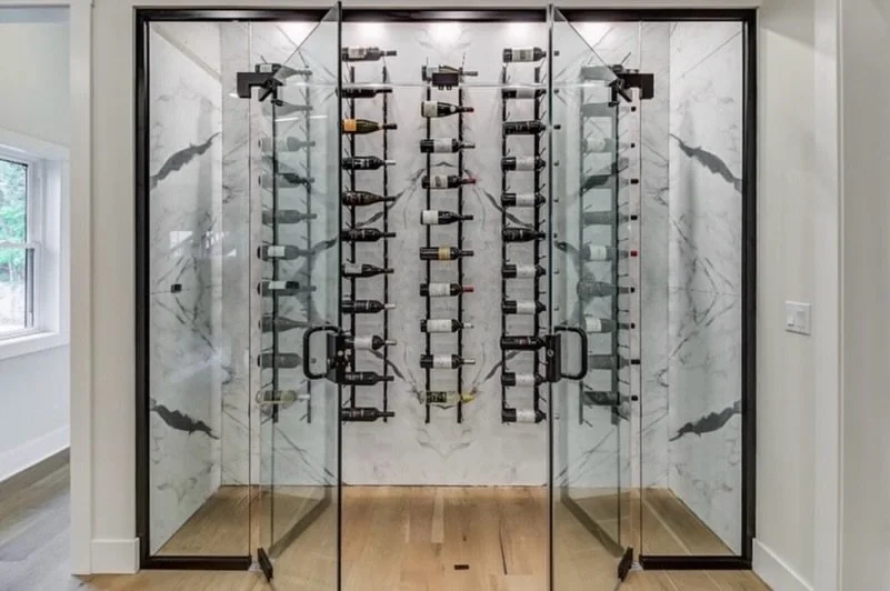 We love the stone in this temperature controlled wine room from our Edgewater project 😍 Would you put one of these in your home? 

Ready to elevate your living space? Visit mancusohomes.com 

#winecellar #winestorage #interiordesign #customrenovatio