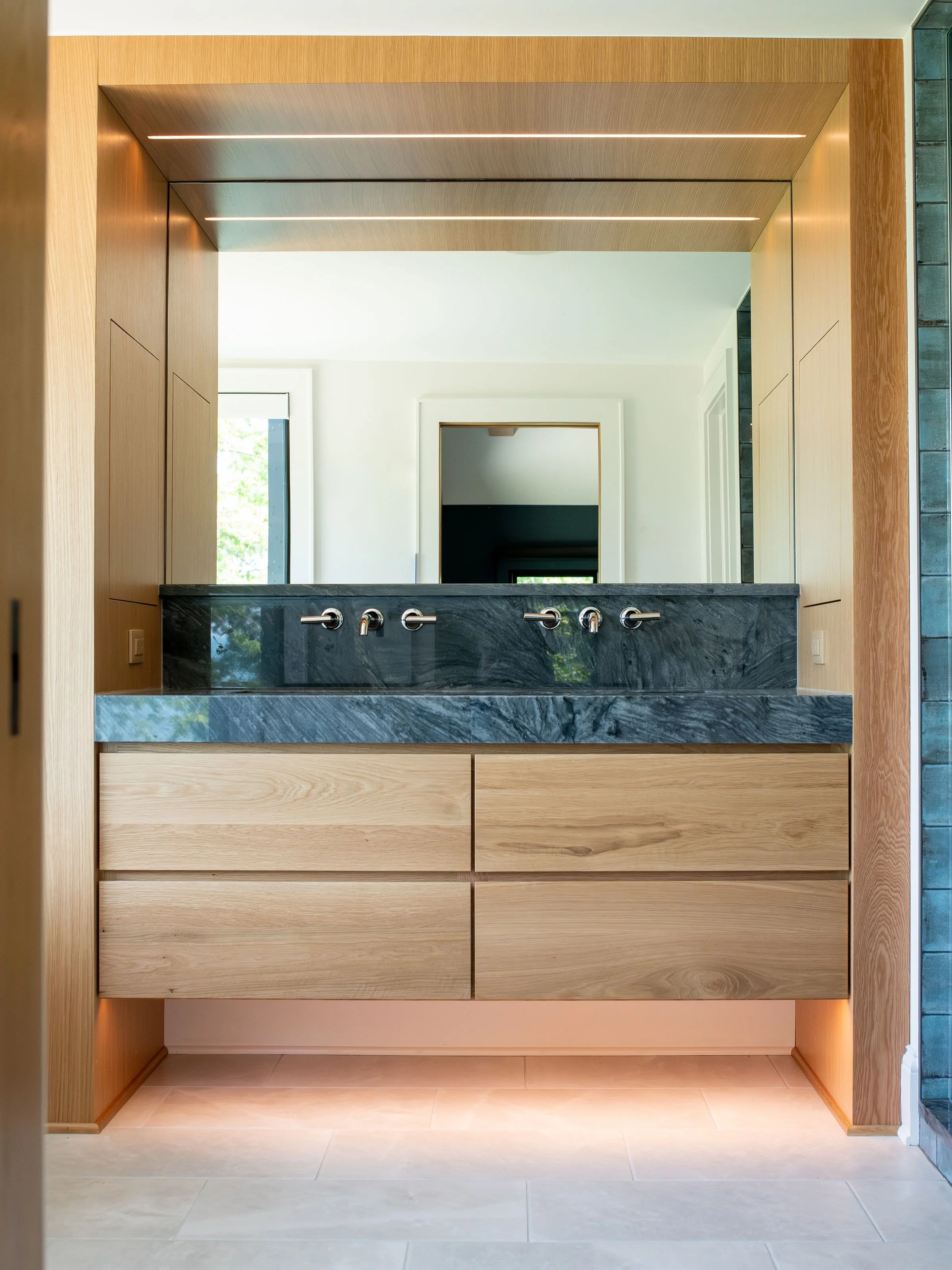 Lake views, natural materials &amp; textured tiles ✨ We love this moody shower in our Lakewood renovation + addition project 😍

What&rsquo;s your favorite detail? 

Thinking of renovating or building an addition? Visit mancusohomes.com 

#bathroomre