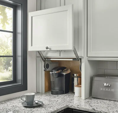Kraftmaid The need for custom cabinets, including those with a built-in appliance garage, should be determined prior to any electrical installation, as these will require additional outlets.