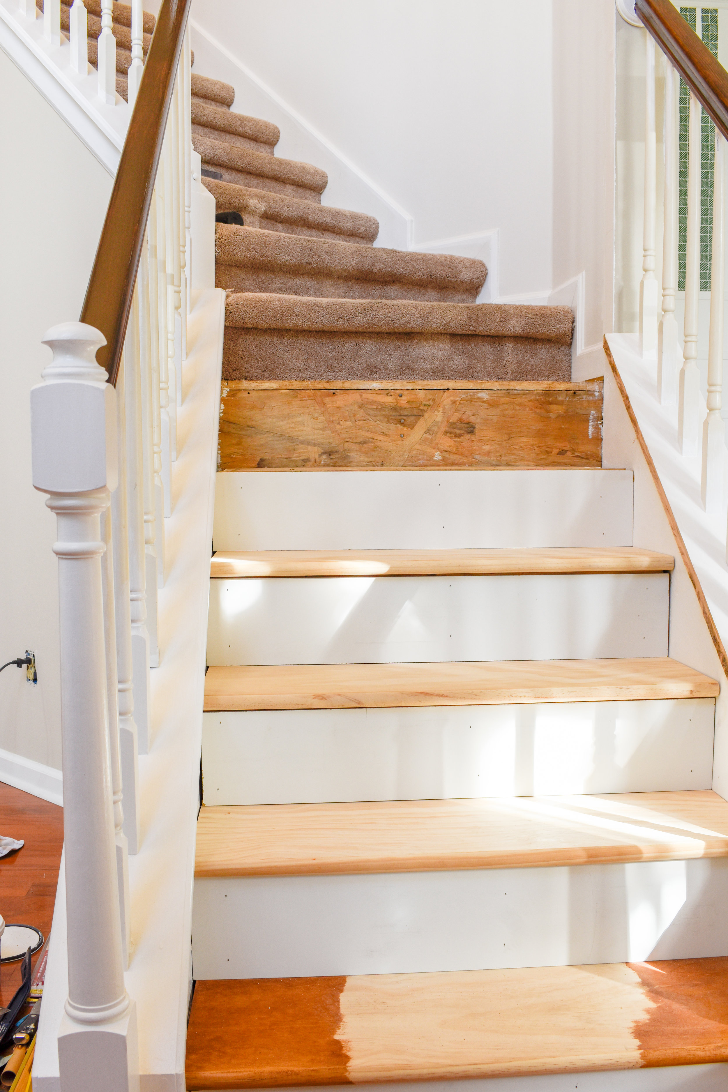 Wood Stair Tread Installation on Pie Steps, Curved Staircase, or Angled Landings - Replacing carpet on stairs that aren’t straight can be tricky but I’m showing you how I made a template to get your cuts exactly right!   #diyhomeupgrades #diyhardwoo…