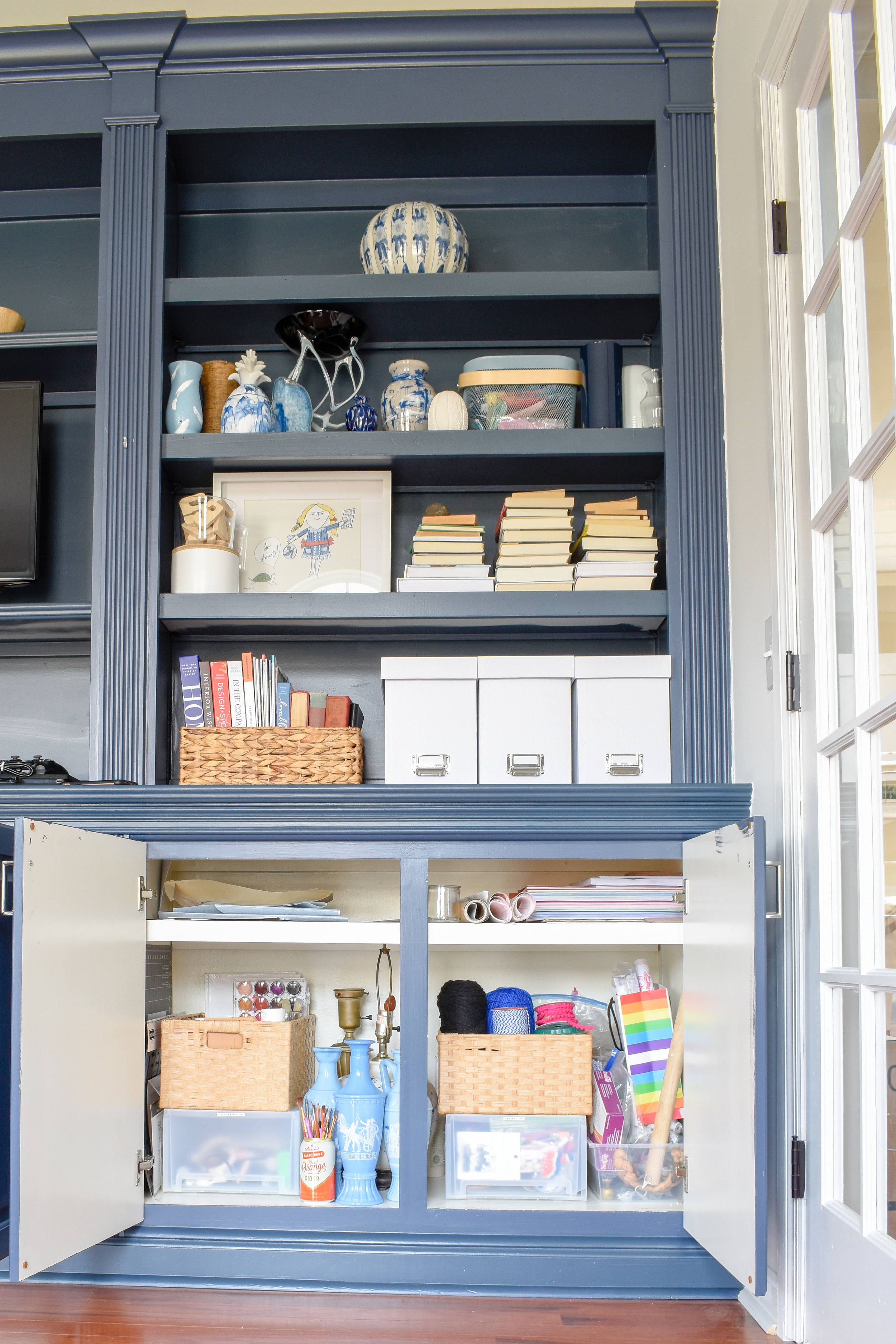 Home Office Storage Ideas - I display my shop's inventory in open shelving that's easy to access and charming.