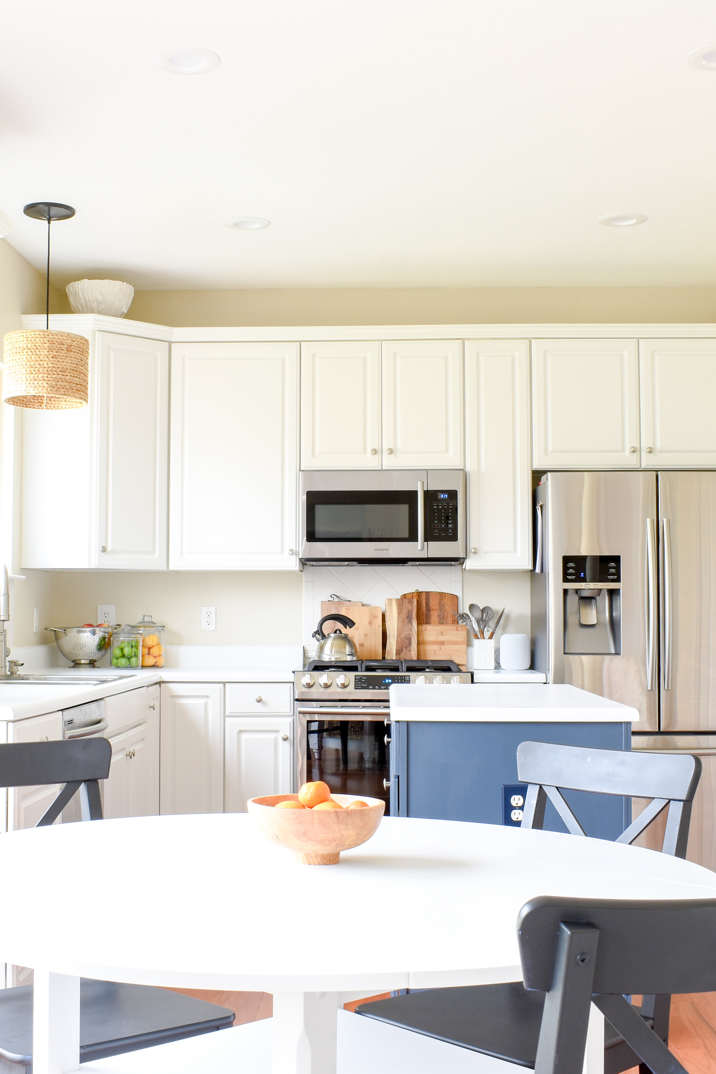 Budget Kitchen Makeover: We've already made great strides in our own kitchen and we haven't replaced any cabinets, counters, or the backsplash! #kitchenideas #whitekitchen #updatedkitchen