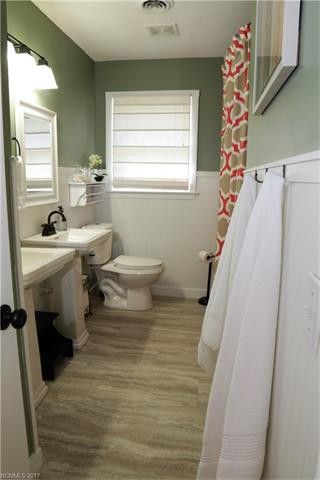 installing vinyl tile over existing tile in a bathroom