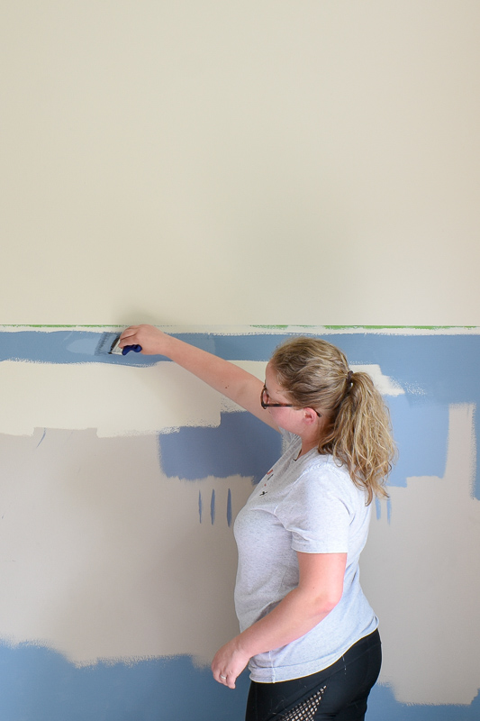 Using upward strokes, (towards the seam of the painter’s tape), paint the edge of the painter’s tape in the wall color you used prior. Painter’s tape will always bleed but when you apply the existing wall color BEFORE your accent color, you’re insur…