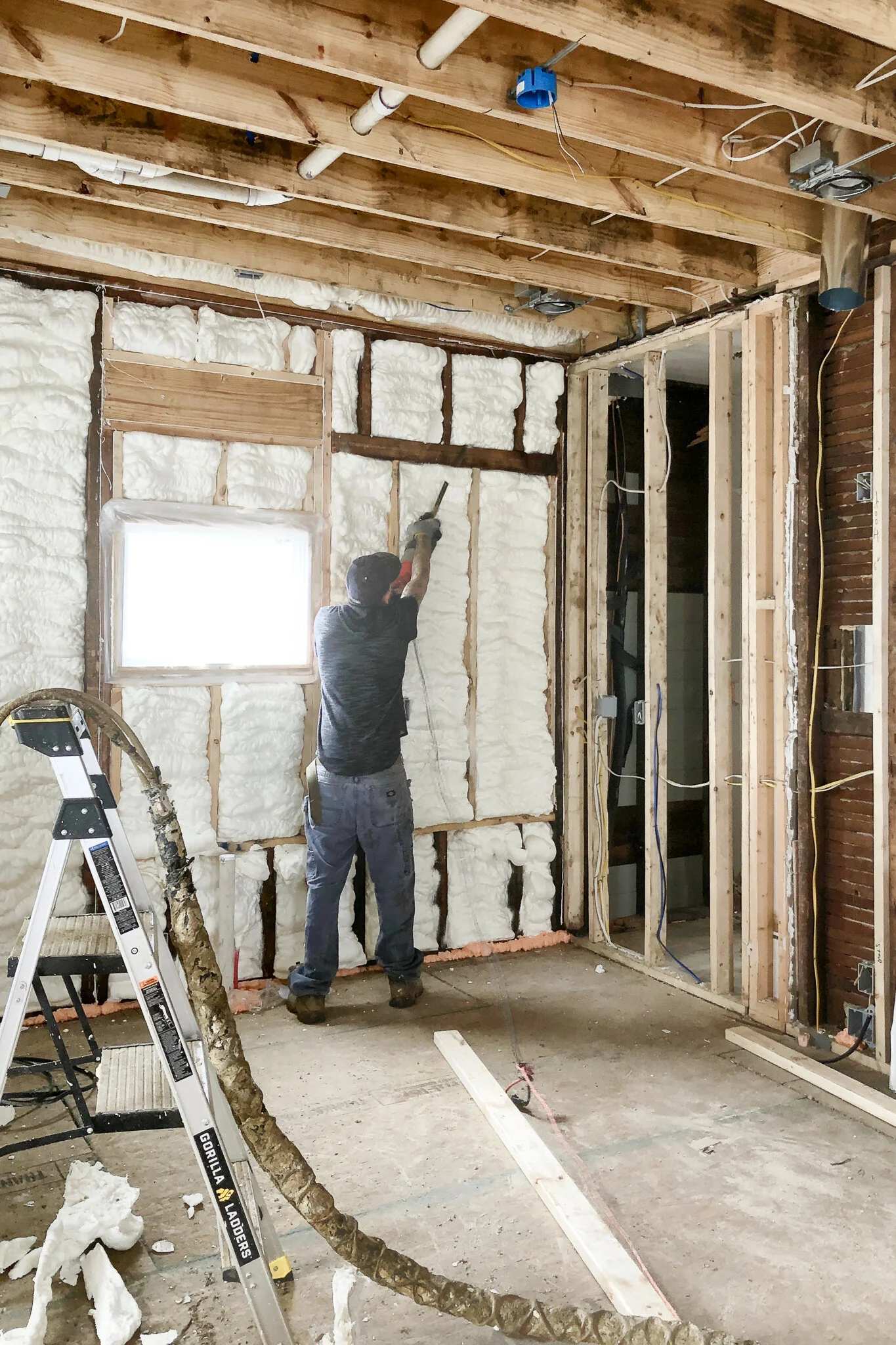 Spray Foam Insulation Sealing an Old House Against Weather — T. Moore Home Interior Design Studio