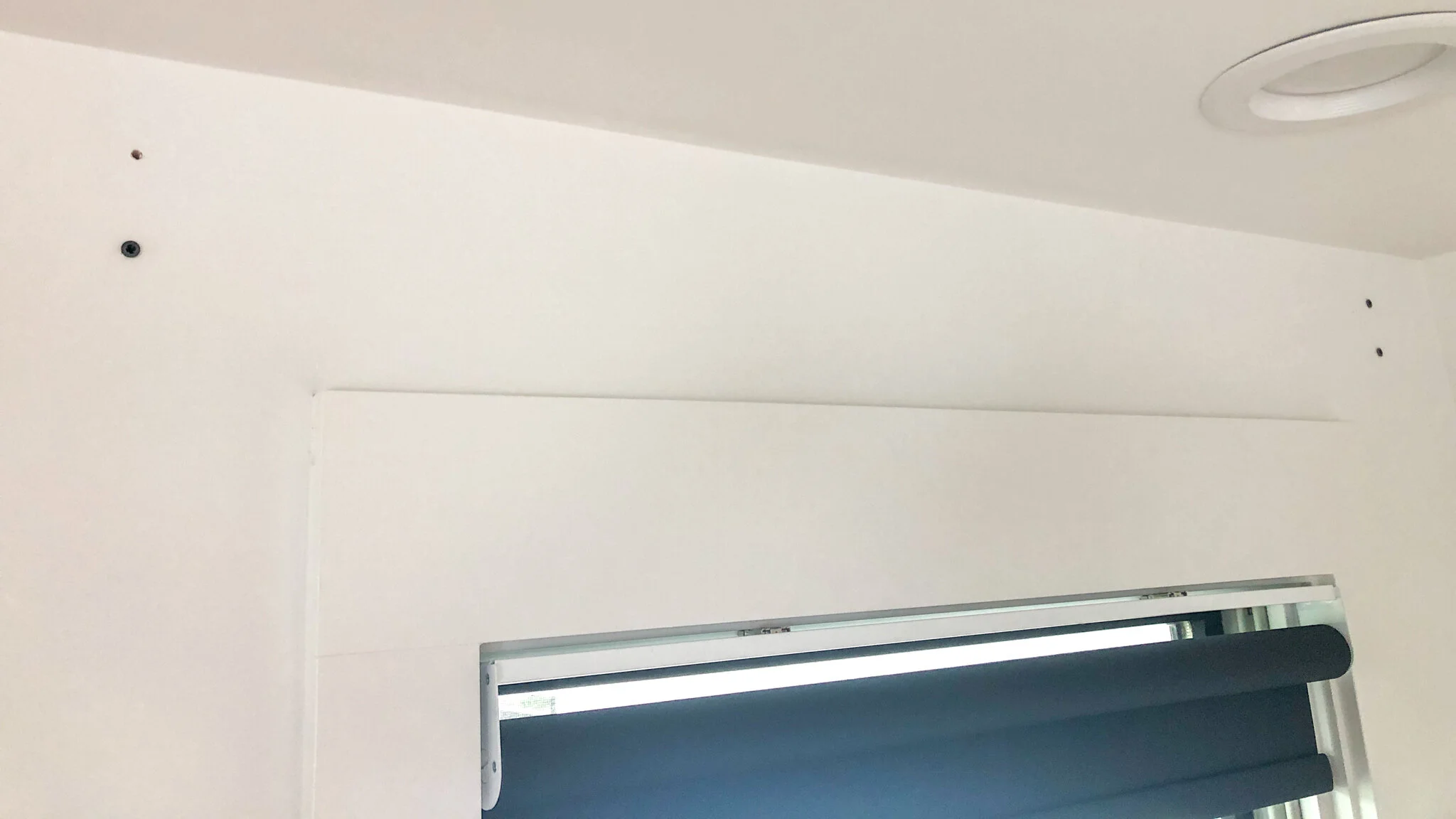 hanging level curtain rods across an entire room