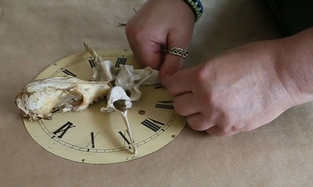 Juliet's hands w:skull clock.jpg
