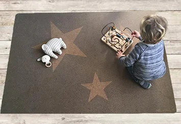 star playmat on wooden floor.jpg