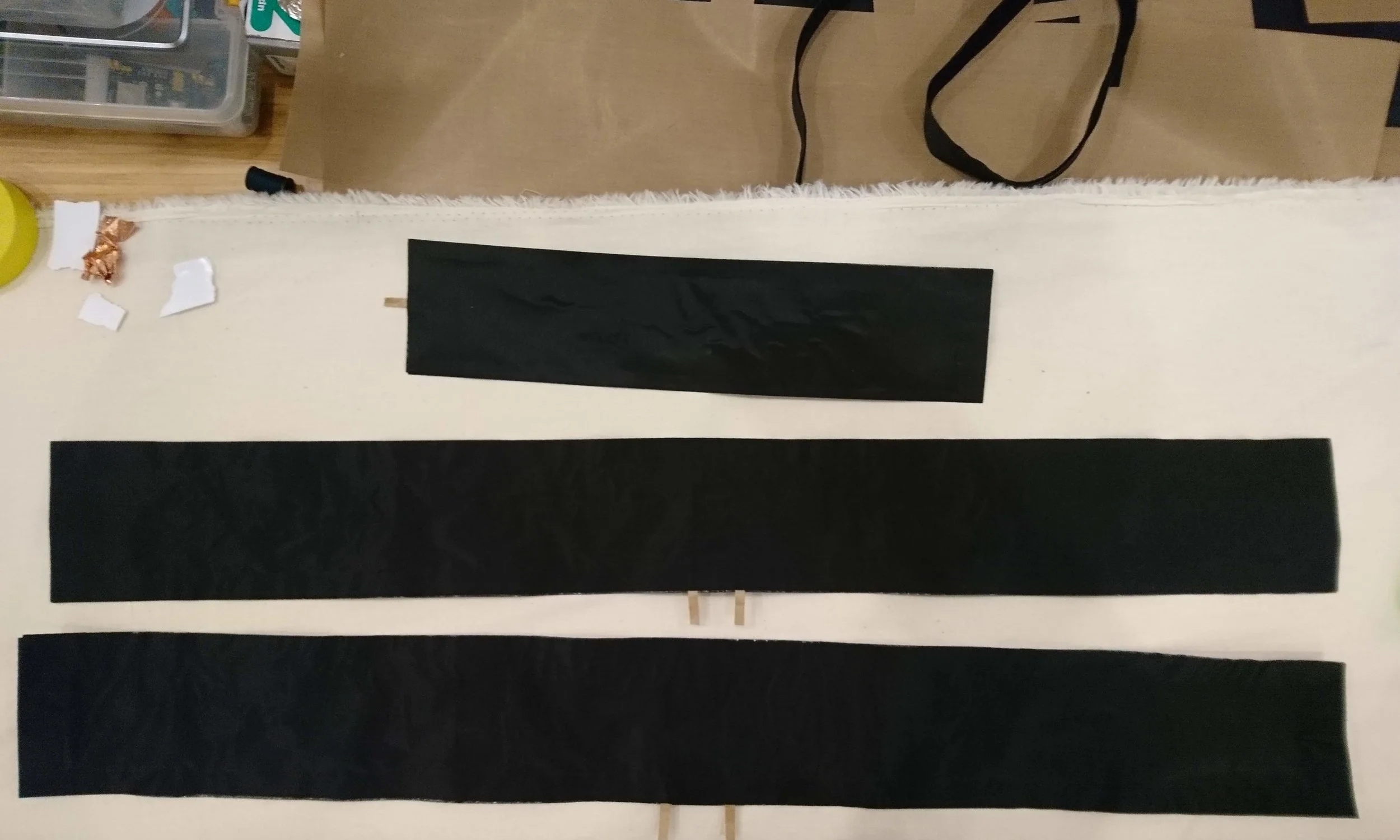 The smaller piece on the top is for the back. The two other strips are for the waist.
