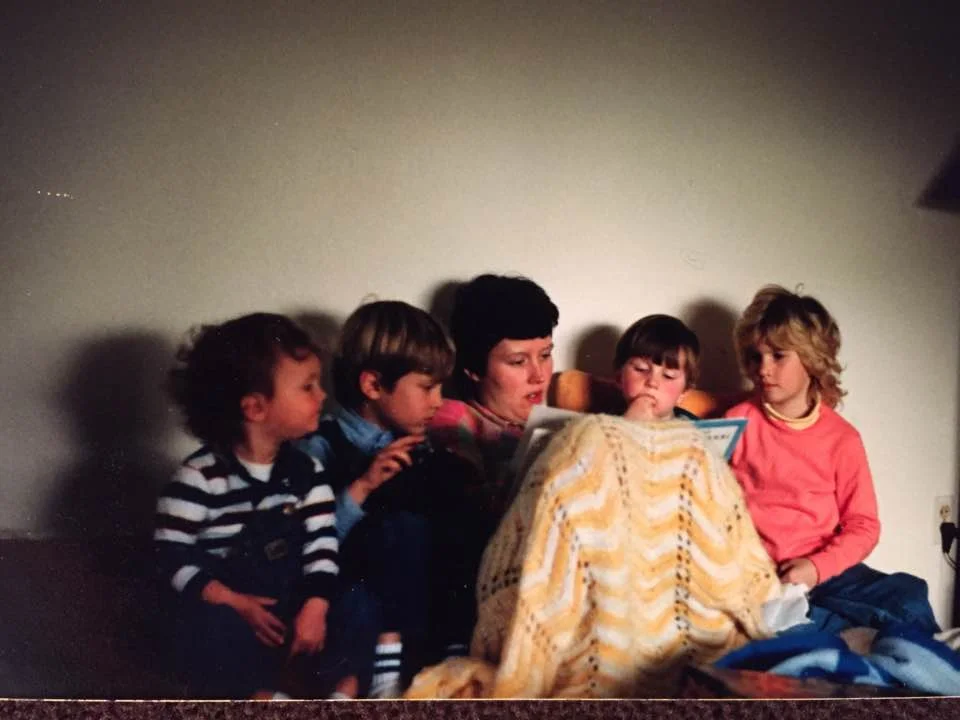 Mrs. April reading to me (on the right with the bad hair) and her boys circa 1988.