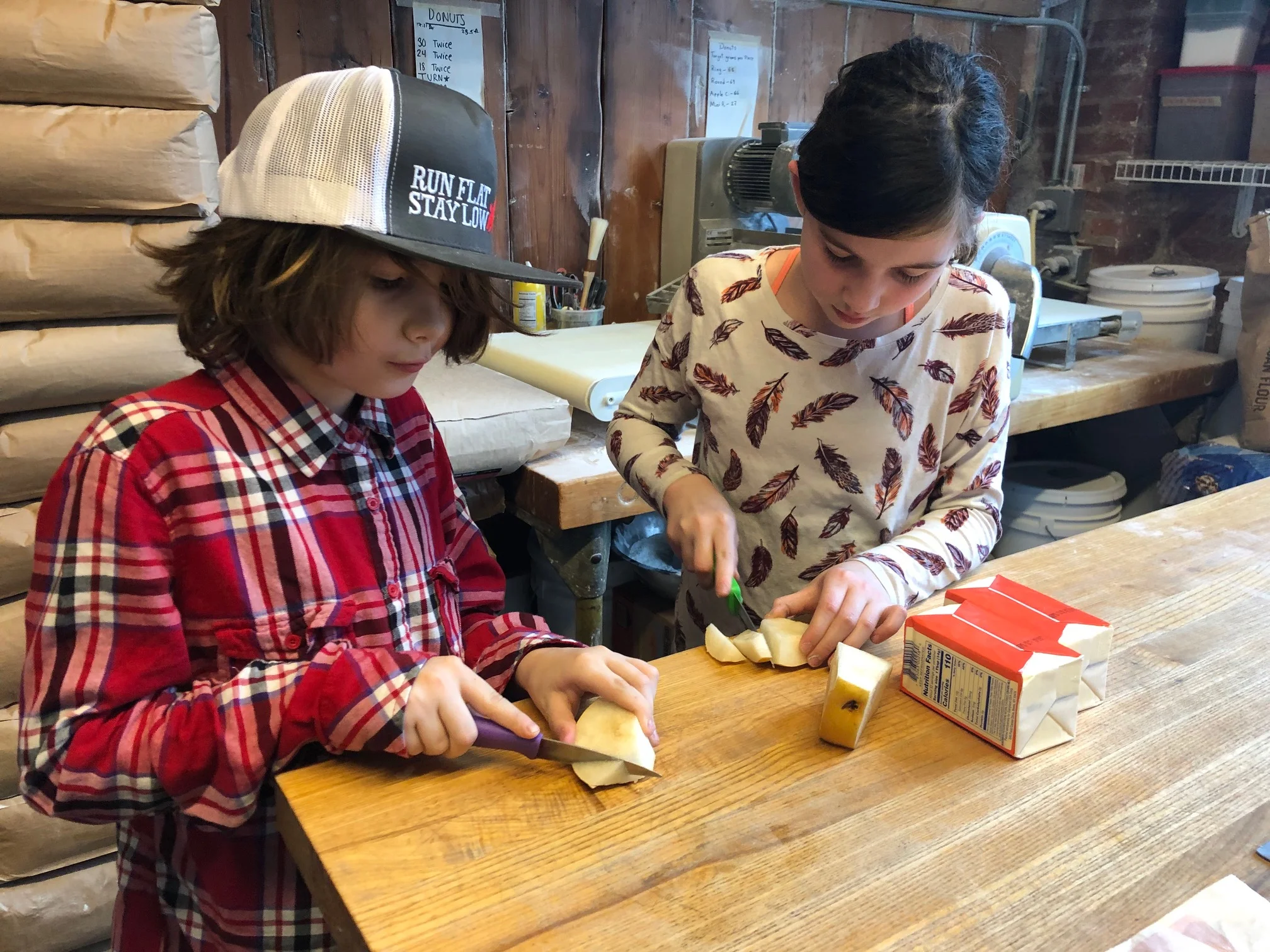 Josie &amp; Keegan snacking before we start making 700 doughnuts!!!