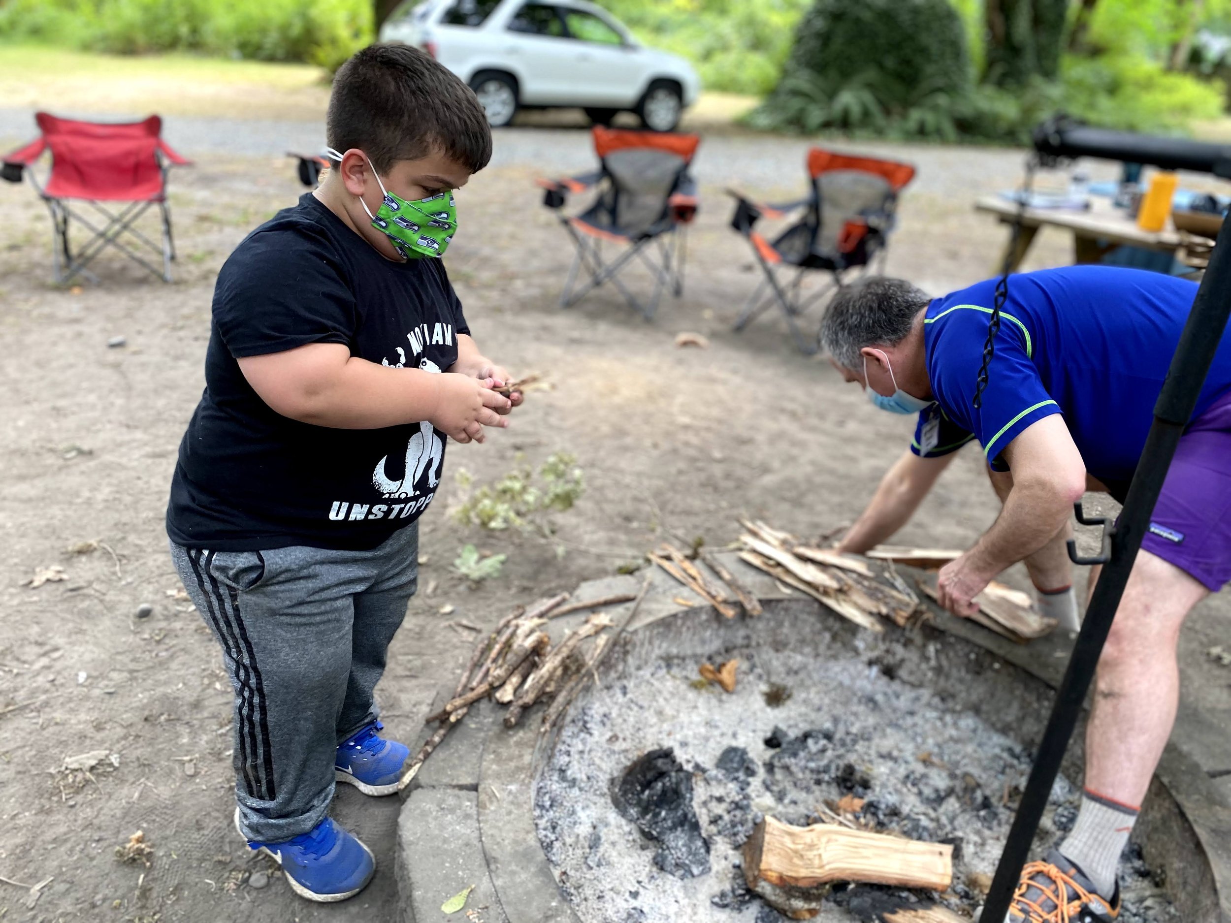  Boundless program participants prepare kindling for the fire during the Boundless Bioluminescence Excursion.  