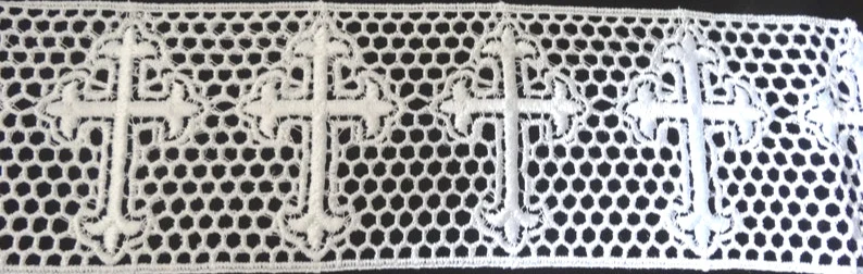 NT1 - Cross design Venise lace measuring 3” wide. Made from white rayon. Currently available from non-traditional source for $2.89 per yard.