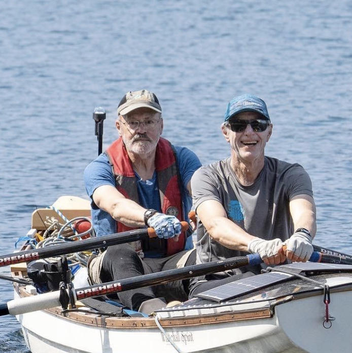 Two men in a 17-foot rowboat take in the glory of the Inside Passage