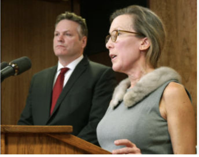 Former temporary budget director Donna Arduin exits stage right