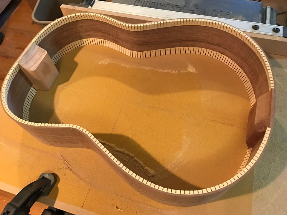 THE CLASSICAL BODY "HOOP" REMOVED FROM THE MOLD. NOTE THAT THE NECK HEEL BLOCK IS ALSO CUT BACK, BUT ON THE BACK SIDE ONLY. THE TOP IS GLUED TO THE HEEL BLOCK IN THIS AREA.