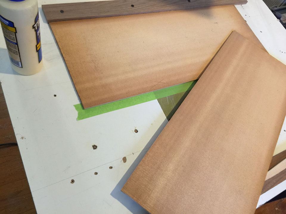 TWO ROUGH-CUT, BOOKMATCHED SPRUCE PANELS ARE READIED FOR GLUING INTO A ROUGH TOP PIECE.