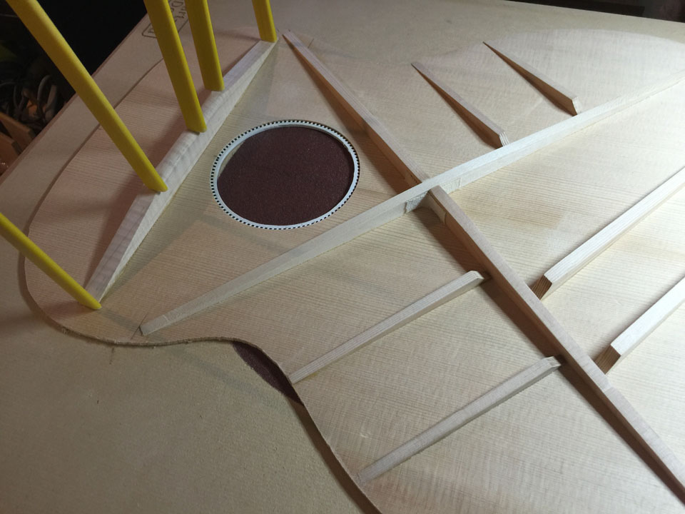 NEARLY-COMPLETED TOP RECEIVES ITS TRANSVERSE NECK BRACE. THE "L"-SHAPED NECK HEEL BRACE GLUES TO BOTH TOP AND THIS TRANSVERSE BRACE.