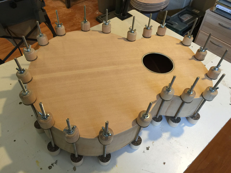 TOP AND BACK ARE GLUED SEPARATELY, CLAMPED WITH CORK-PADDED "SPOOL" CLAMPS.