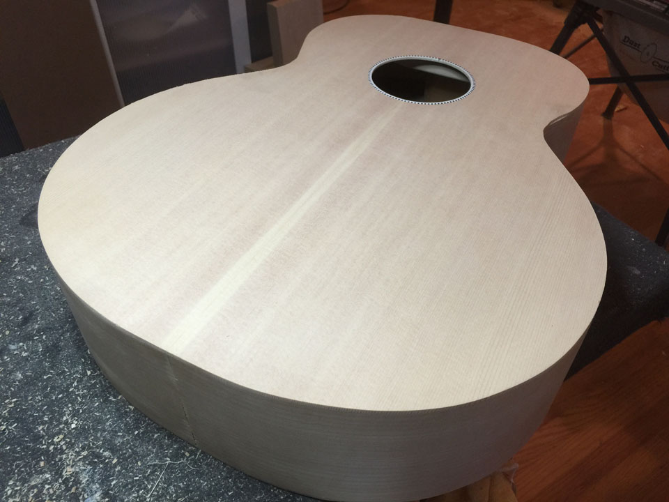 THE FINAL-TRIMMED BODY STILL NEEDS MUCH WORK: BINDING, NECK DOVETAIL, BOTTOM "FLASH" MUST BE CUT AND FITTED. THIS BECAME THE "BLUEBURST" JUMBO WHICH WAS USED TO RECORD THE ACOUSTIC SOUND SAMPLES.