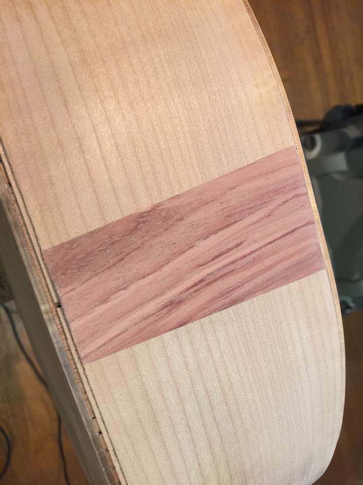 A CONTRASTING TULIPWOOD "FLASH" AGAINST A MAPLE BACKGROUND.