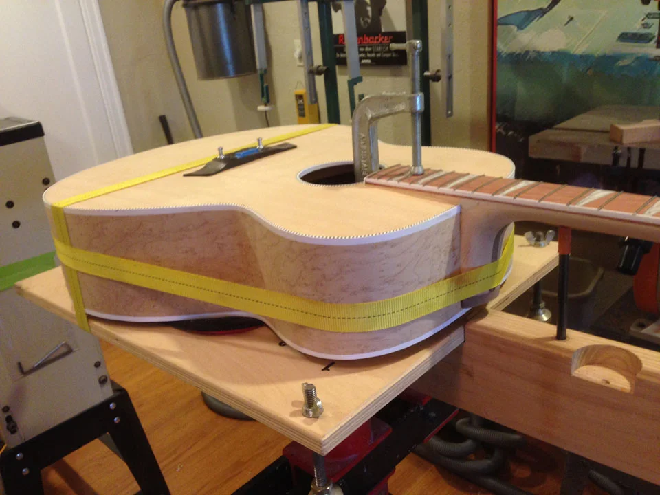 HERE THE STRAP CLAMP HAS JUST BEEN TIGHTENED. SEVERAL HUNDRED POUNDS OF FORCE ARE EXERTED.