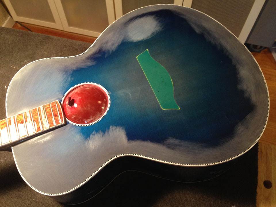 SECOND CLEAR COAT SEES SPECIAL SANDING ATTENTION PAID TO SMALL FLAWS AND EDGES OF BINDING.