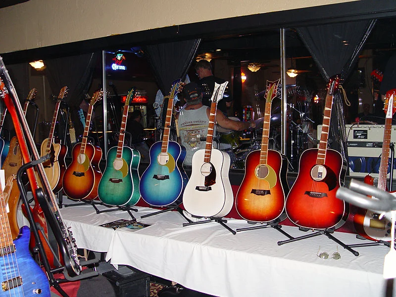 A group of 9 Studio California-built Rickenbacker acoustic guitars, as shown at a Rickenbacker convention in 2012.