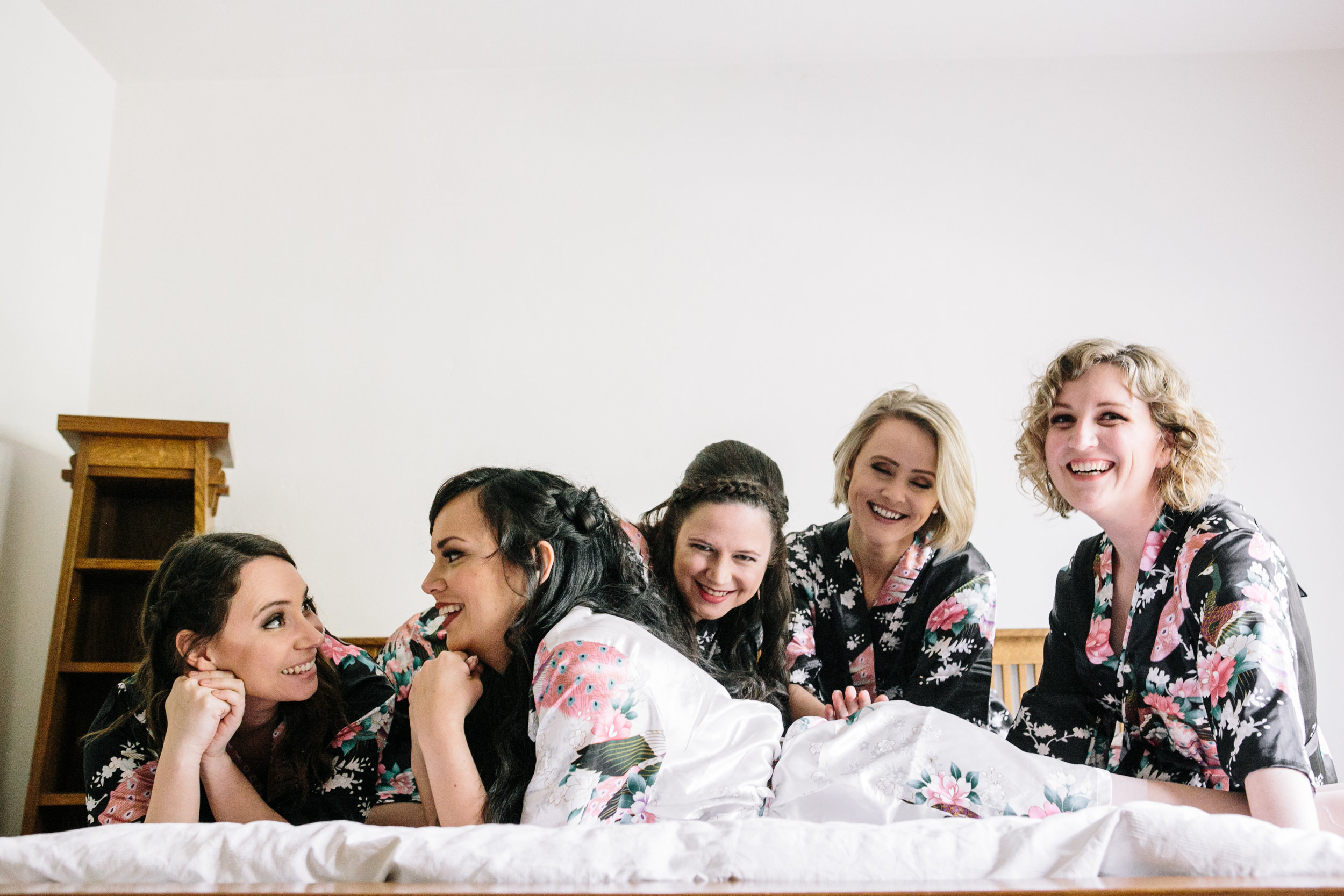 Bridesmaids and Bride have fun before wedding bells