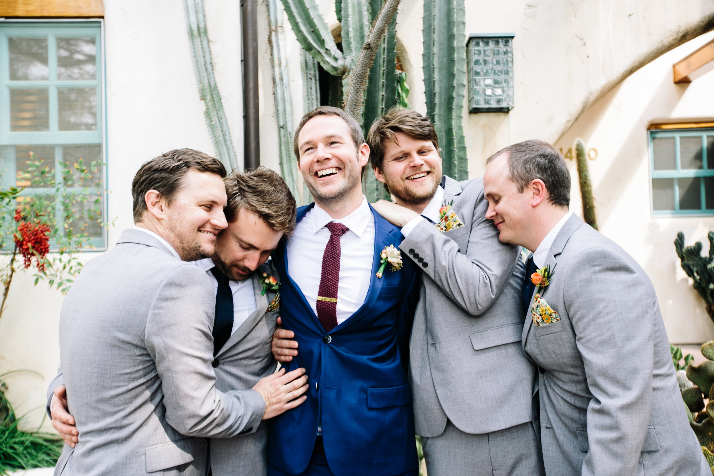 groomsmen have a snuggle moment