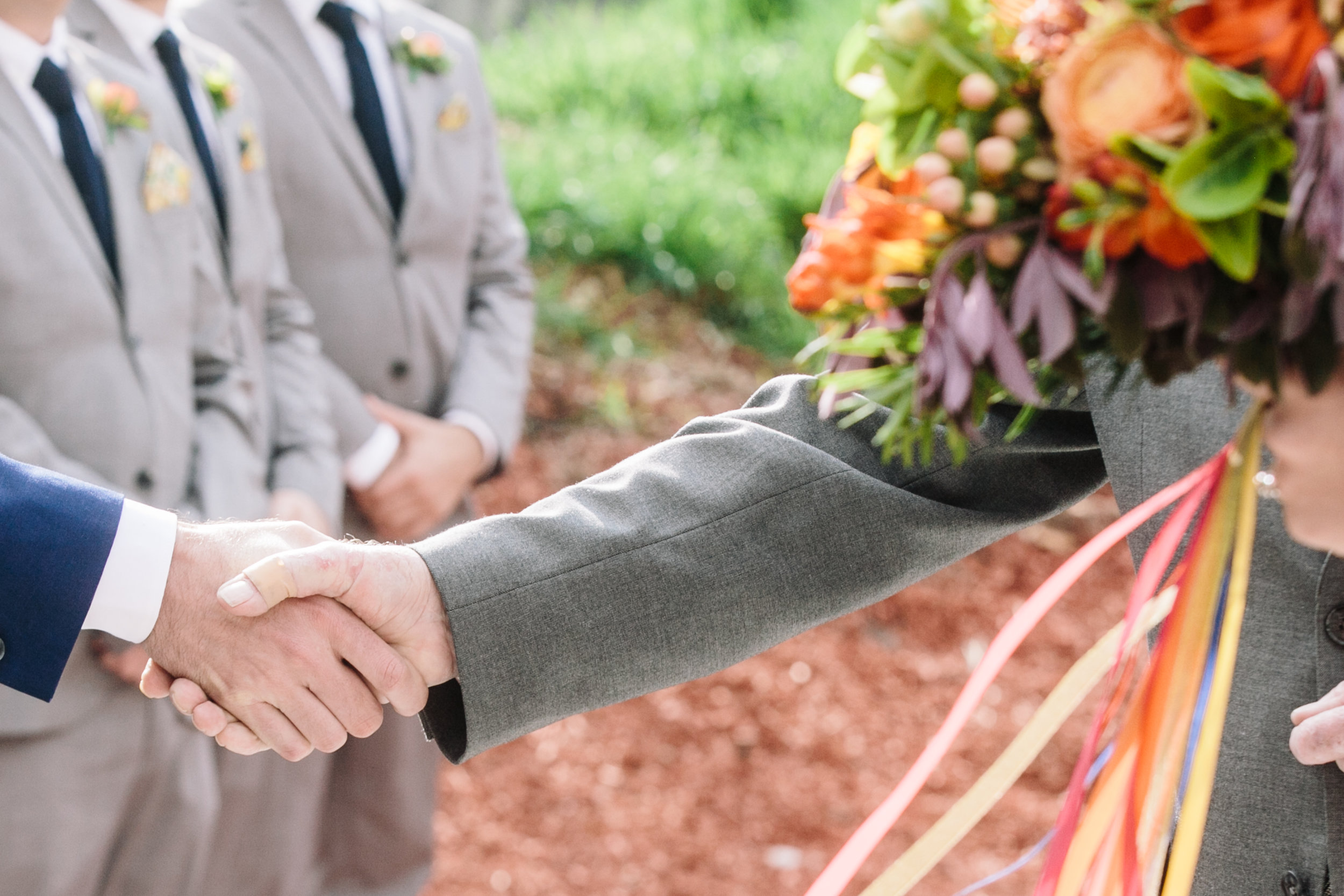 Groom and Father of the bride shake hands