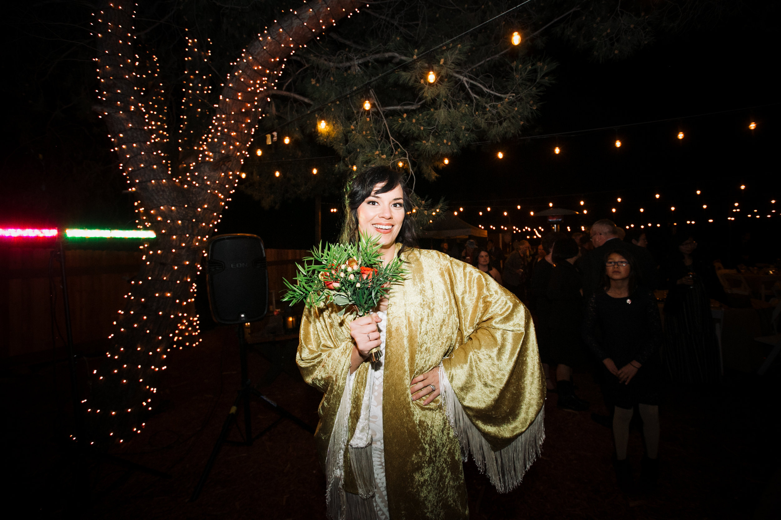 Bride prepares to toss bouquet 