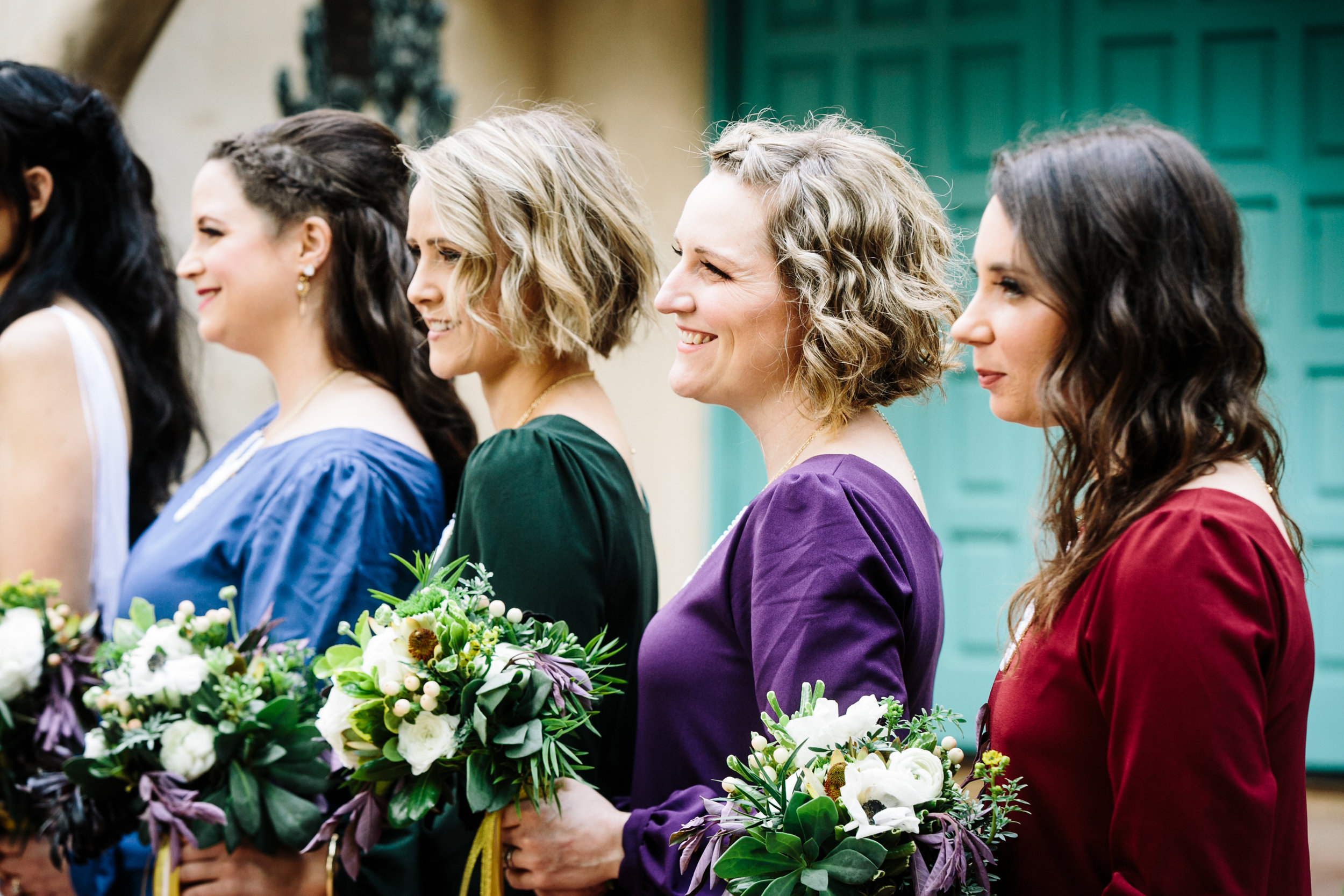 bridesmaids hold bouquet 