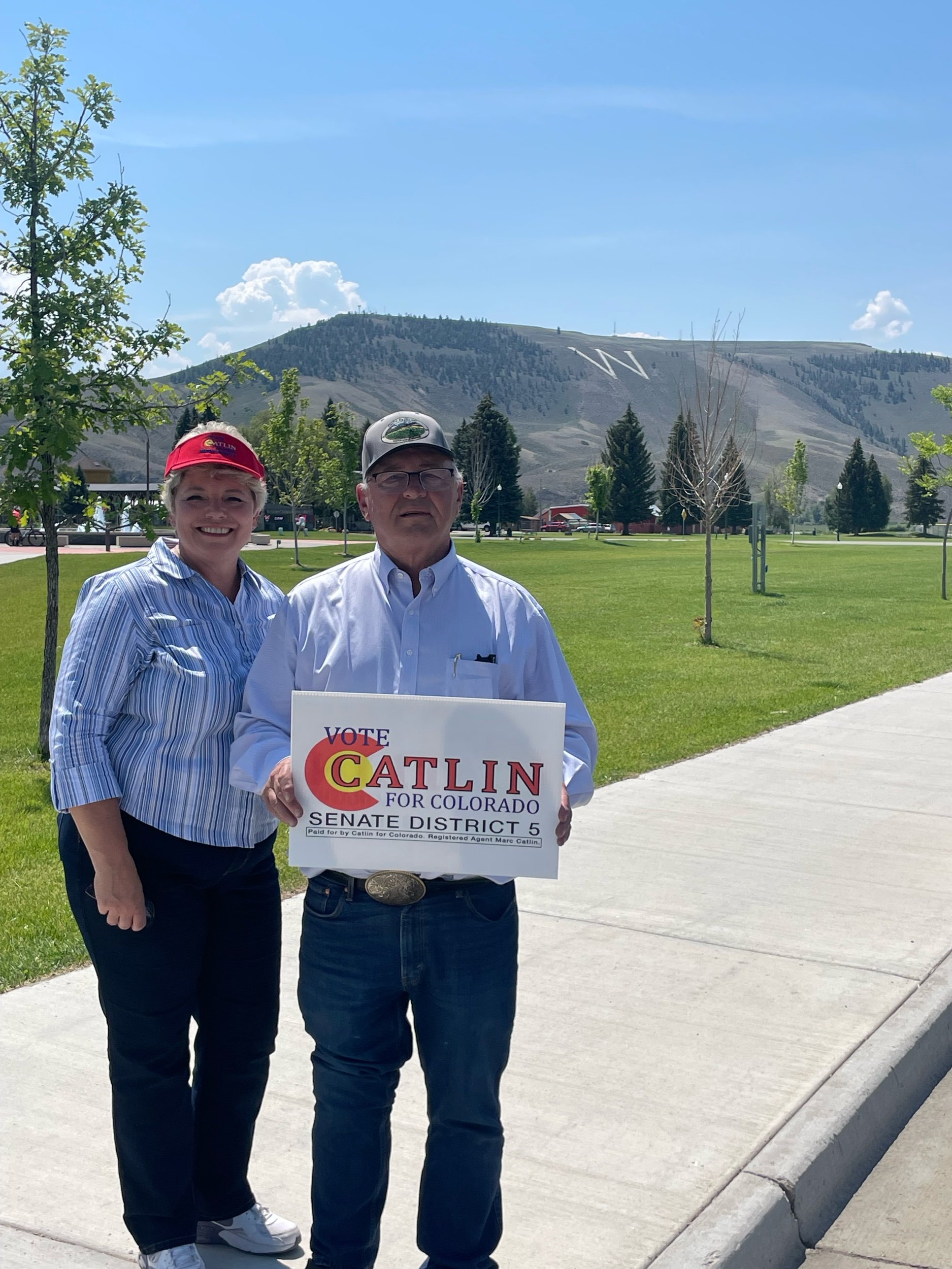 Marc and Kerri Catlin stand in front of Western Colorado University’s “W” in Gunnison, Colorado.