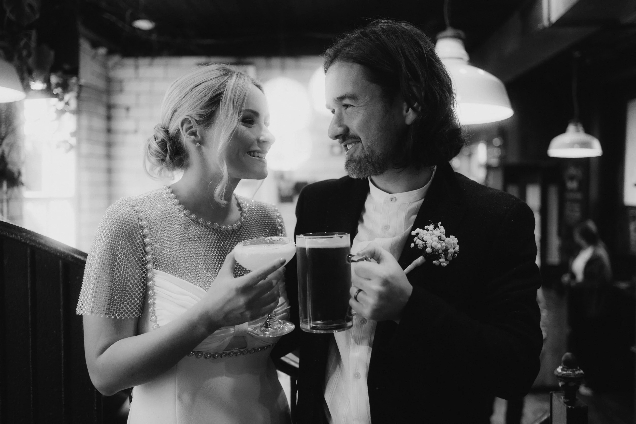 Glasgow city centre wedding portrait with a double exposure effect, showing a couple facing each other with colourful graffiti-style artwork by Rogue Oner layered within their silhouettes.