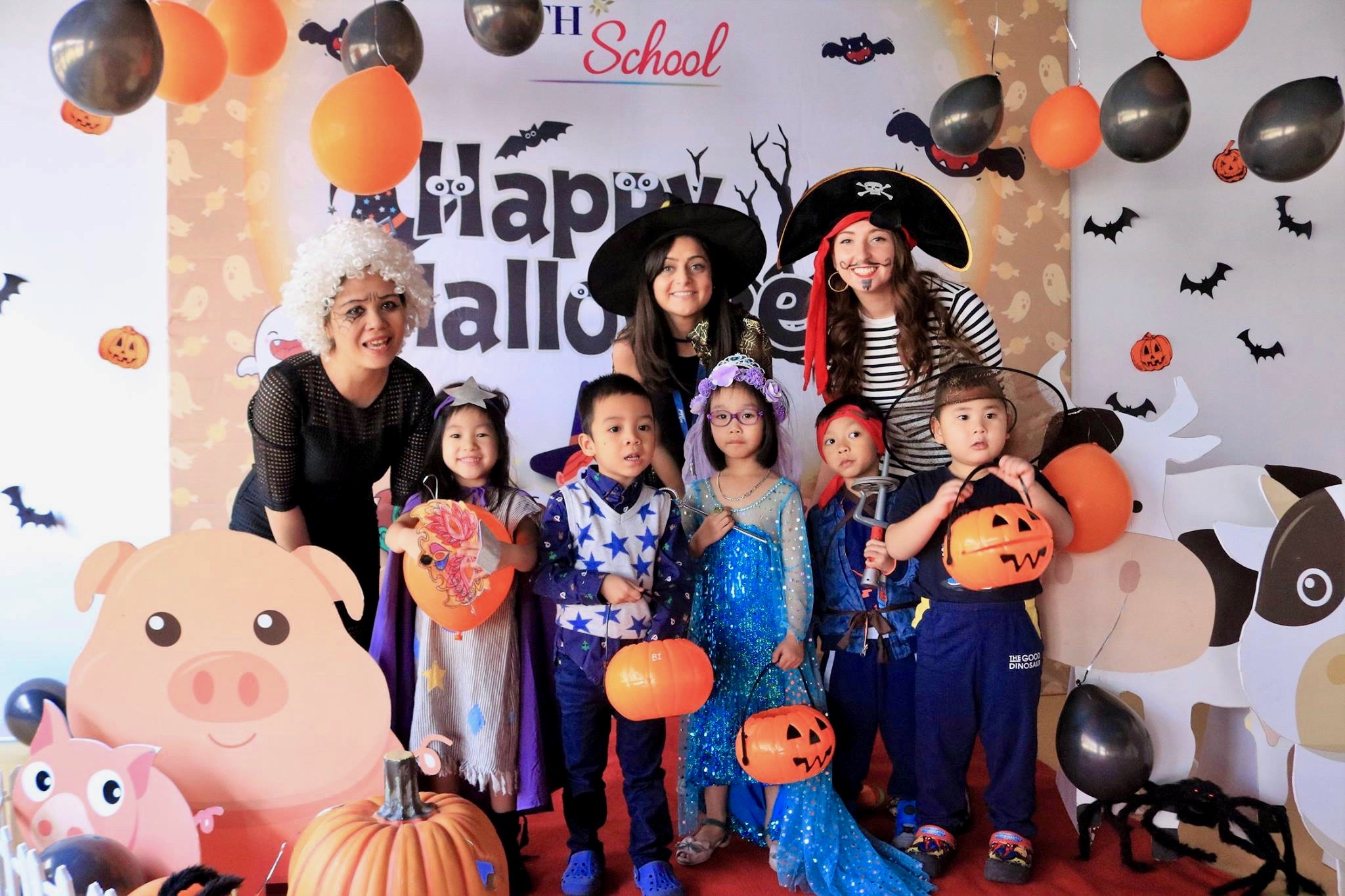 Ms Emily with many trick-or-treaters