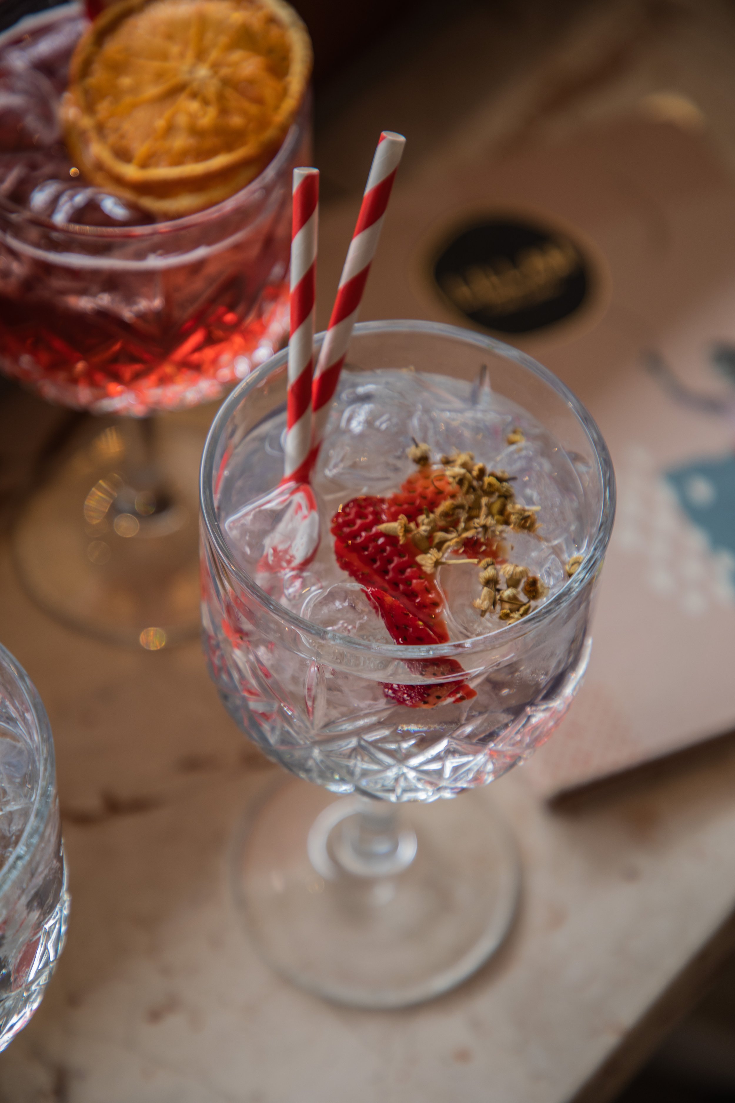  Poor Toms Dry Gin with Fever Tree Elderflower Tonic, fresh strawberry &amp; chamomile. Best gin tonic in Sydney 