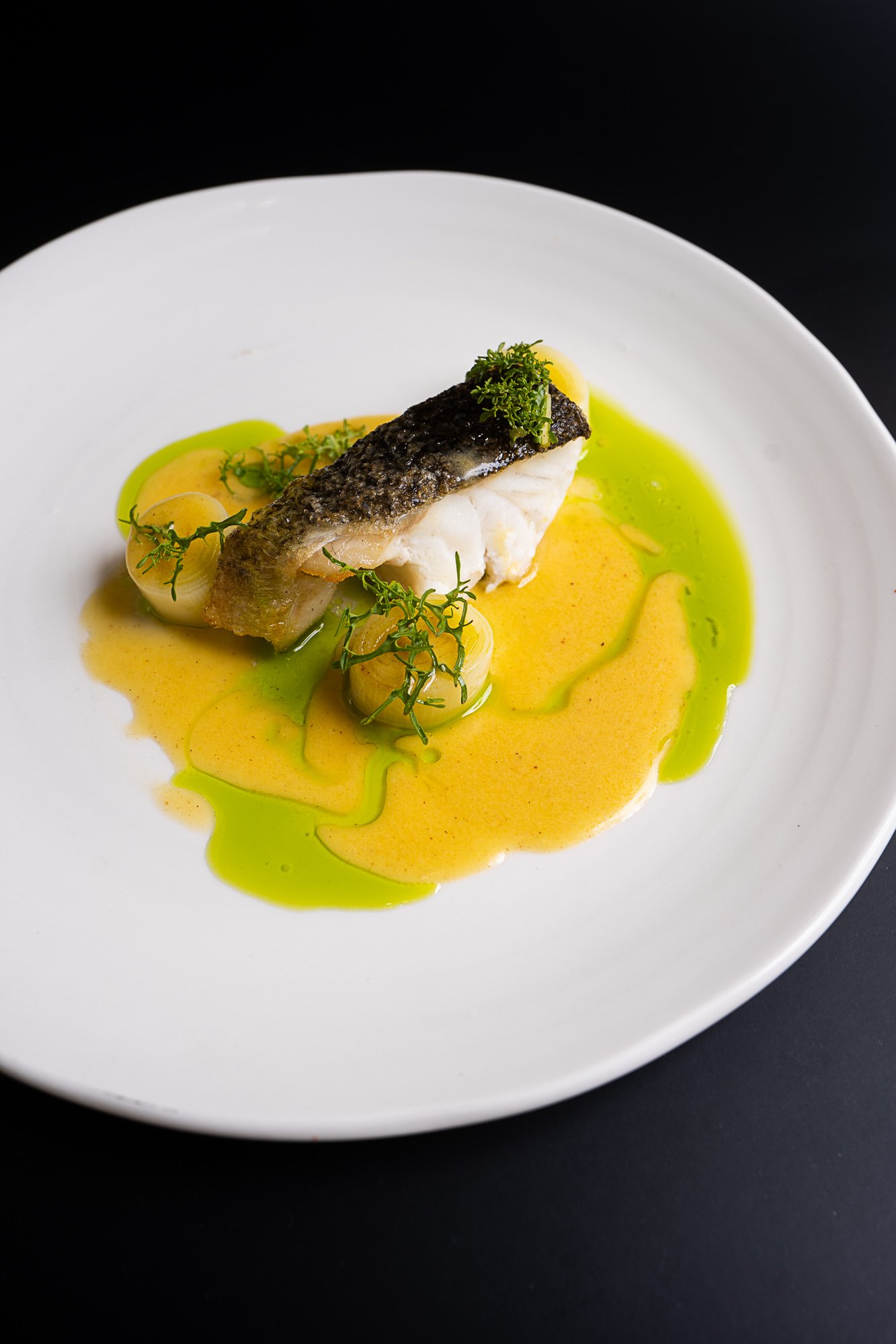 Pesce al forno – Murray cod with leeks and broth - high side shot.jpg