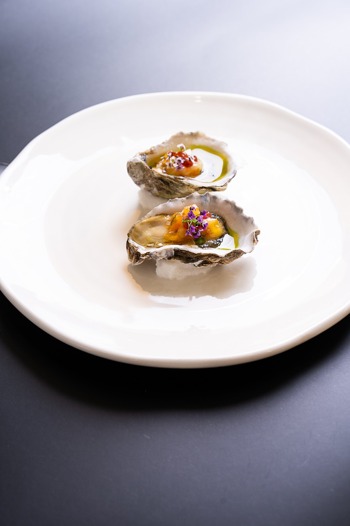 Ostrica con mela - oysters with persimmon, chili and avruga caviar, presentation at Little Black Pig & Sons.jpg