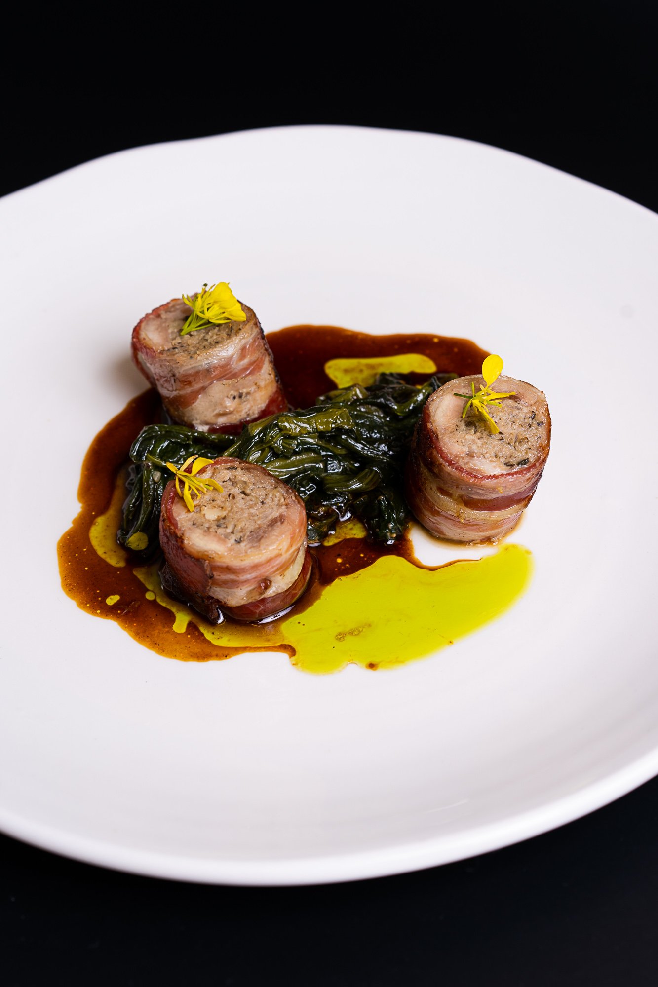 Stuffed quail with braised spinach pine nuts, raisins and jus1.jpg